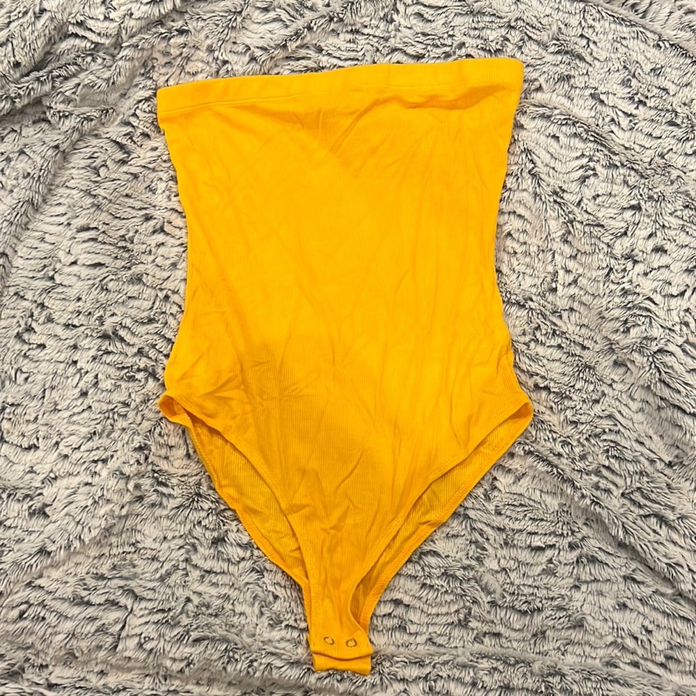 Selling a gold strapless bodysuit! Very light and soft. Sized Medium.